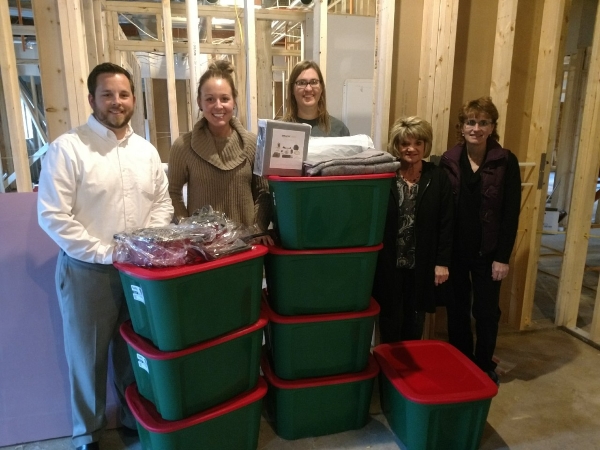 Members of the Sinnott Agency team with the household items they gathered to donate to House of Hope.